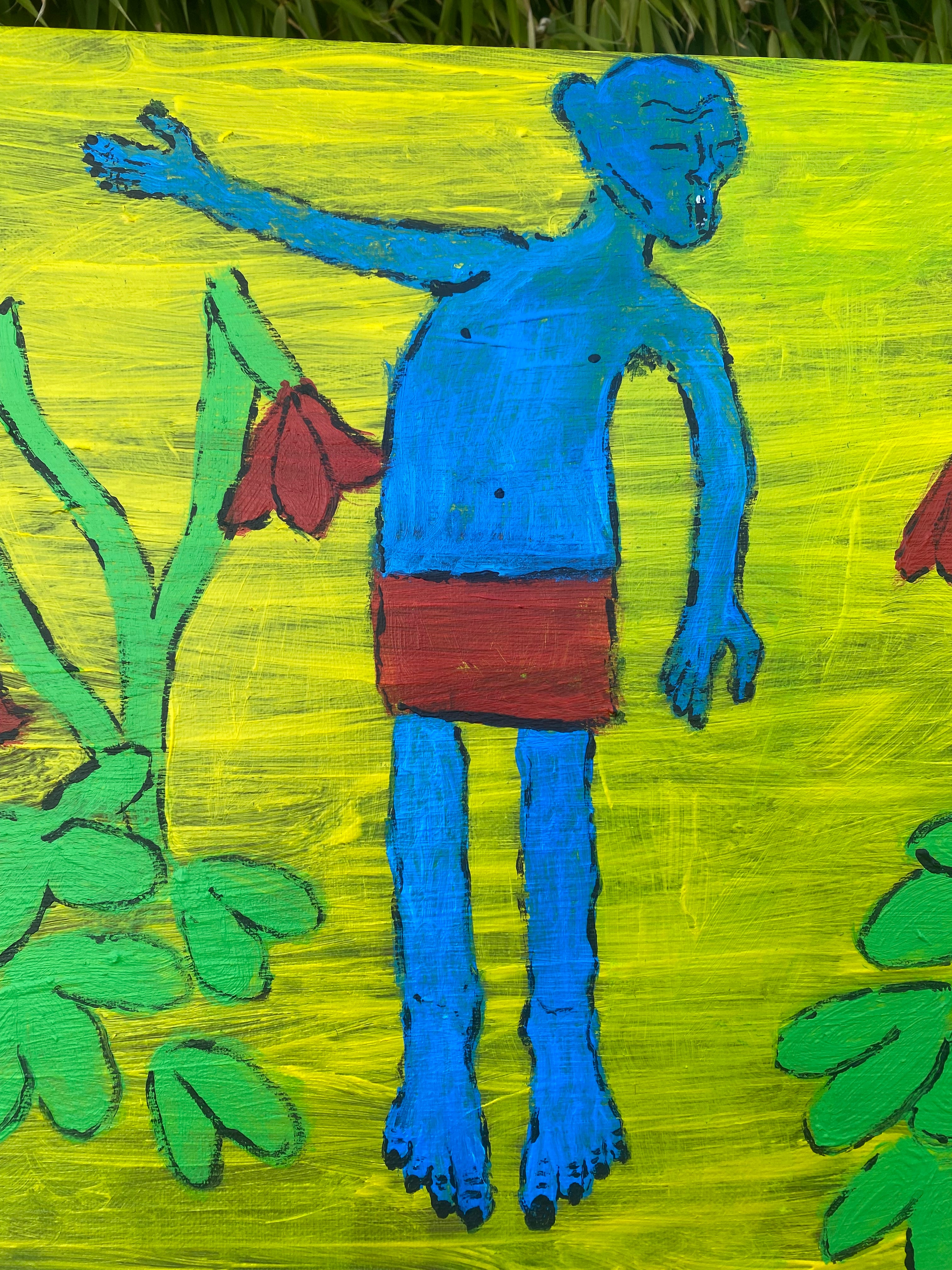 “der Mann zwischen Blumen“